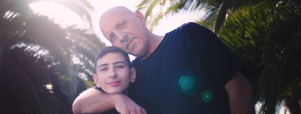 Epilepsy patient John with his father Spiro